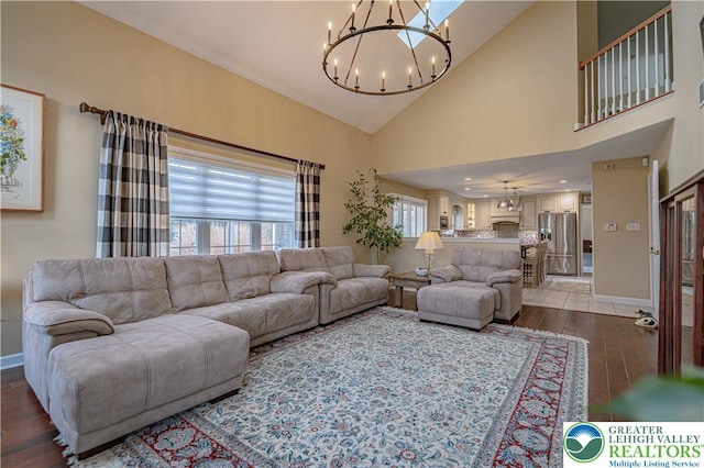 4408 Irish Creek Rd, Pa, PA 19506 - living area featuring light wood-style floors, a chandelier, baseboards, and high vaulted ceiling