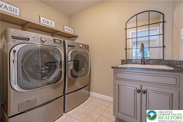 4408 Irish Creek Rd, Pa, PA 19506 - washroom with independent washer and dryer, cabinet space, light tile patterned floors, and baseboards