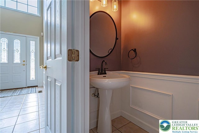 4408 Irish Creek Rd, Pa, PA 19506 - bathroom featuring tile patterned floors, wainscoting, a decorative wall, and a sink
