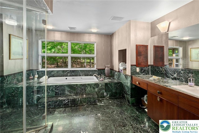 310 Hunters Farm Rd, Paradise Twp, PA 18332 - full bath featuring vanity, marble tiled floors, a garden tub, and a shower stall