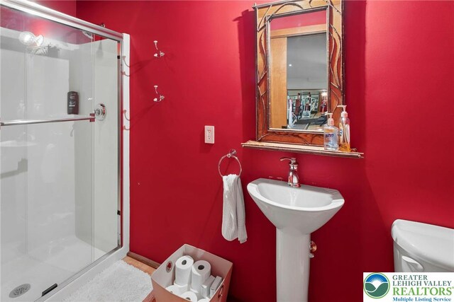 310 Hunters Farm Rd, Paradise Twp, PA 18332 - bathroom with toilet and a stall shower