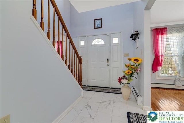 190 Reunion Rdg, Stroud Twp, PA 18301 - entryway with baseboard heating, stairs, and healthy amount of natural light