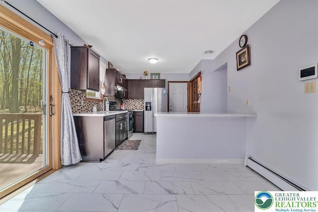 190 Reunion Rdg, Stroud Twp, PA 18301 - kitchen with appliances with stainless steel finishes, baseboard heating, light marble finish flooring, dark brown cabinets, and light countertops