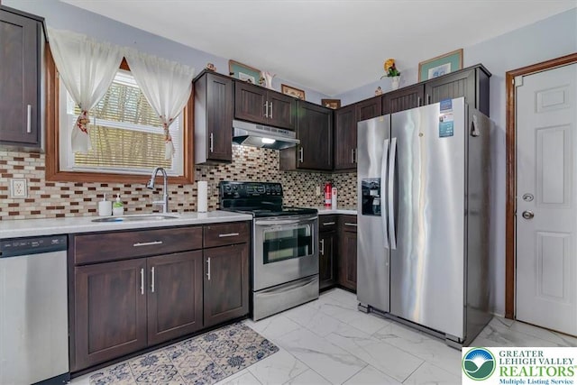190 Reunion Rdg, Stroud Twp, PA 18301 - kitchen featuring stainless steel appliances, under cabinet range hood, a sink, light marble finish flooring, and light countertops