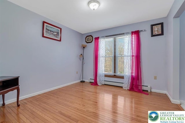 190 Reunion Rdg, Stroud Twp, PA 18301 - spare room with light wood finished floors, baseboards, and a baseboard radiator