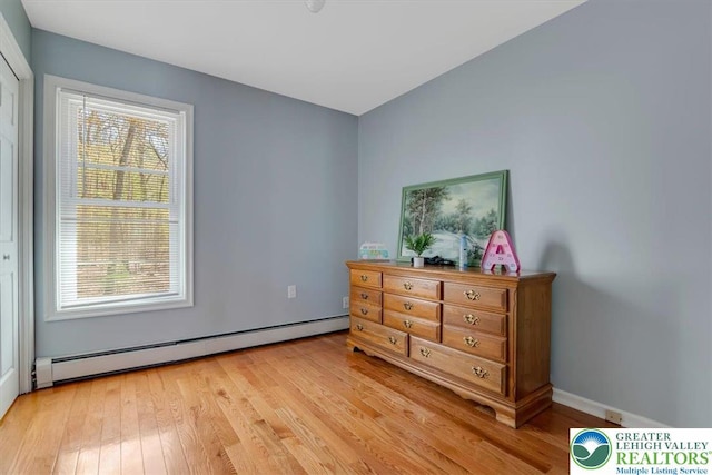 190 Reunion Rdg, Stroud Twp, PA 18301 - bedroom with a baseboard heating unit and light wood-style floors
