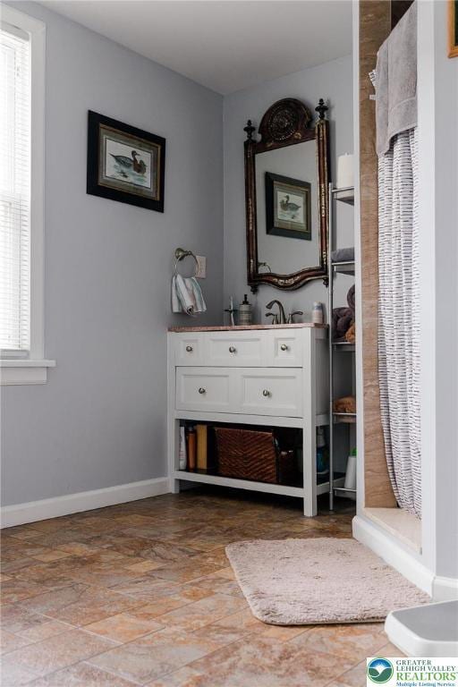 433 S 19th St, Easton, PA 18042 - full bathroom featuring a shower stall, baseboards, and vanity