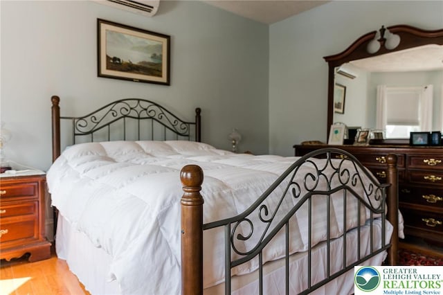 433 S 19th St, Easton, PA 18042 - bedroom featuring wood finished floors and a wall unit AC