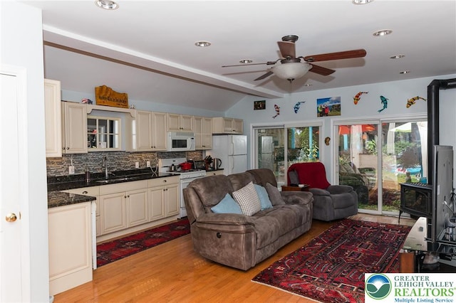 433 S 19th St, Easton, PA 18042 - living room with a ceiling fan, lofted ceiling, light wood-type flooring, recessed lighting, and a wood stove