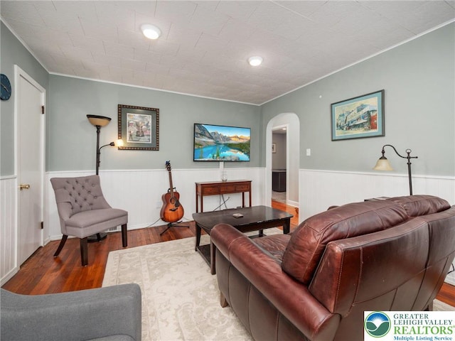 30 Morgan Hill Rd, Williams Twp, PA 18042 - living area with arched walkways, wood finished floors, ornamental molding, and wainscoting