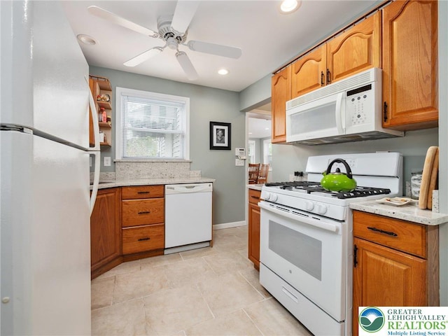 30 Morgan Hill Rd, Williams Twp, PA 18042 - kitchen featuring white appliances, light tile patterned floors, brown cabinetry, ceiling fan, and recessed lighting