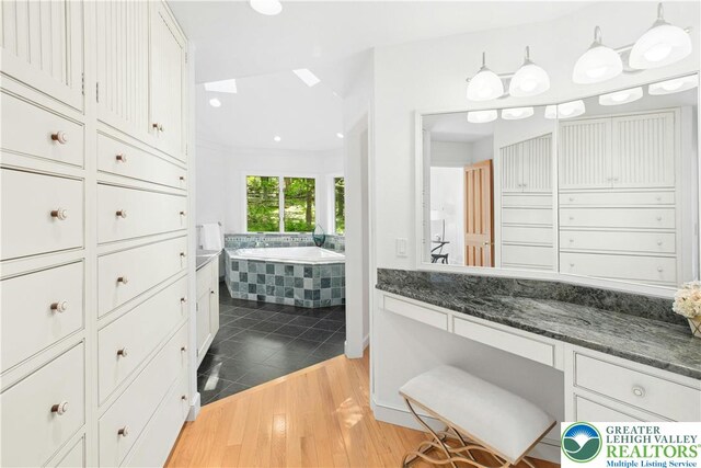 511 Center Hill Rd, Nockamixon Twp, PA 18972 - full bathroom with a garden tub, wood finished floors, and vanity