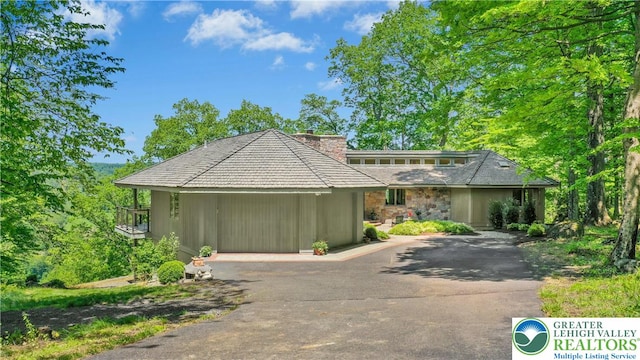511 Center Hill Rd, Nockamixon Twp, PA 18972 - view of front of home with asphalt driveway, a chimney, and stone siding