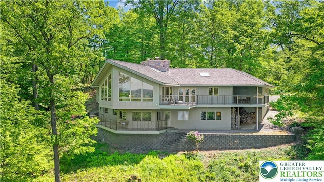 511 Center Hill Rd, Nockamixon Twp, PA 18972 - back of property featuring a chimney and a patio area