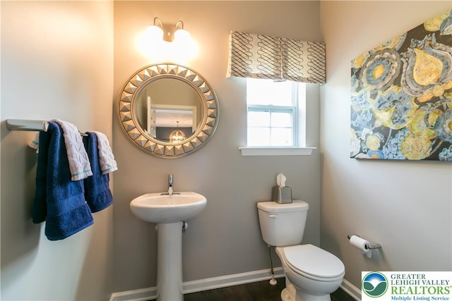 1350 Lorton Dr Unit 56, Forks Twp, PA 18040 - half bathroom with toilet, baseboards, and wood finished floors