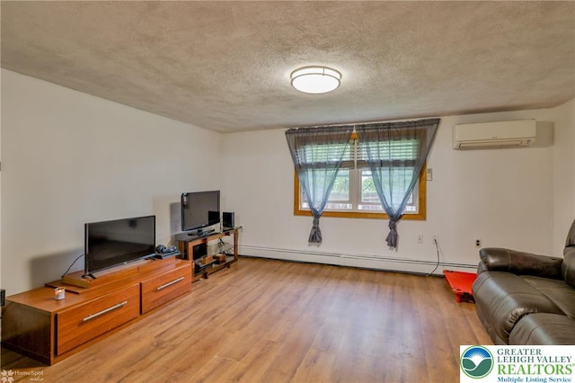 717 Frost Hollow Rd, Easton, PA 18040 - living area with a wall mounted AC, a baseboard heating unit, wood finished floors, and a textured ceiling