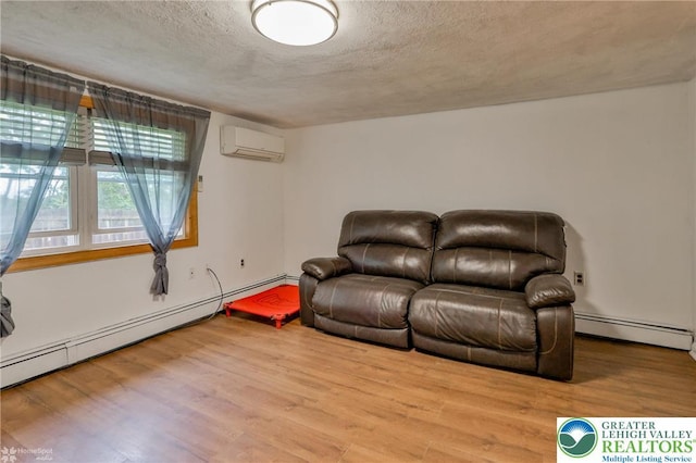 717 Frost Hollow Rd, Easton, PA 18040 - living area with a wall mounted air conditioner, a baseboard heating unit, wood finished floors, a textured ceiling, and baseboard heating