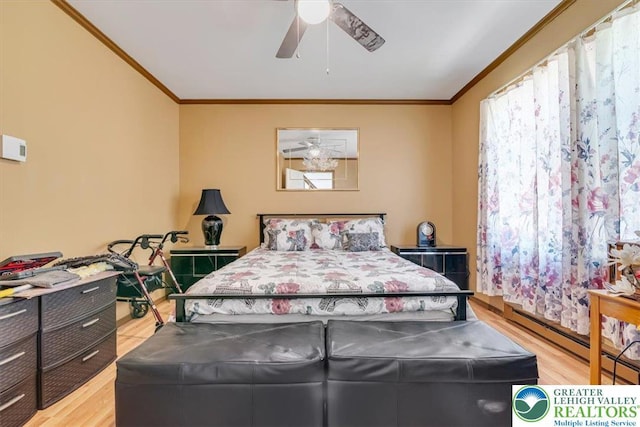 1281 Winding Way, Coolbaugh Twp, PA 18466 - bedroom with ornamental molding, wood finished floors, a ceiling fan, and a baseboard radiator