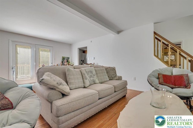 1281 Winding Way, Coolbaugh Twp, PA 18466 - living room featuring beam ceiling, light wood-style flooring, and stairs