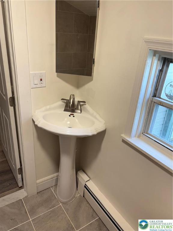 2101 Columbia Ave, Whitehall Twp, PA 18052 - bathroom featuring a baseboard radiator and tile patterned floors