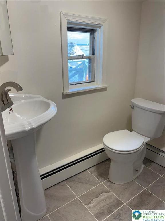 2101 Columbia Ave, Whitehall Twp, PA 18052 - bathroom with a baseboard radiator, toilet, and tile patterned floors