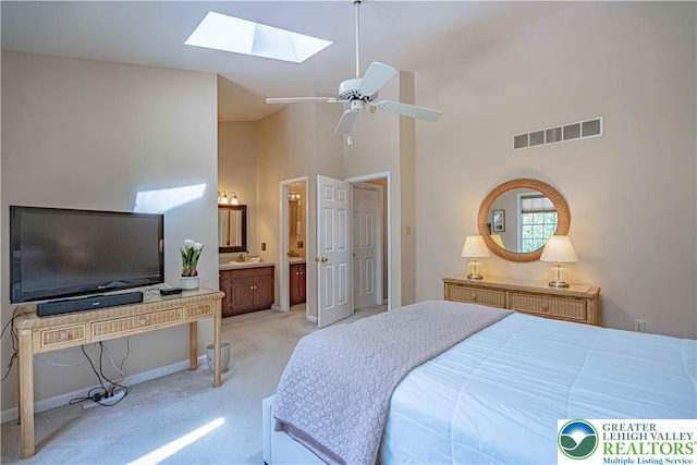 1514 Ravena St Unit Dd, Bethlehem City, PA 18015 - bedroom featuring light carpet, a skylight, high vaulted ceiling, baseboards, and ensuite bathroom