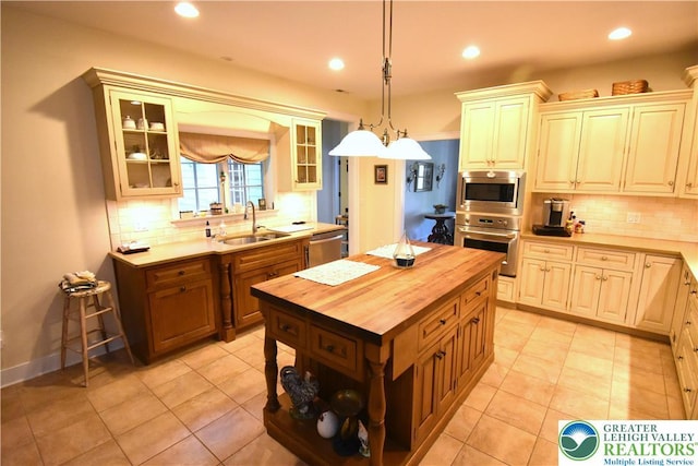 135 Coffeetown Rd, Easton, PA 18042 - kitchen with stainless steel appliances, wood counters, a sink, decorative backsplash, and recessed lighting