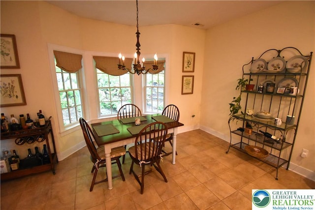 135 Coffeetown Rd, Easton, PA 18042 - dining area featuring a chandelier, baseboards, and light tile patterned floors