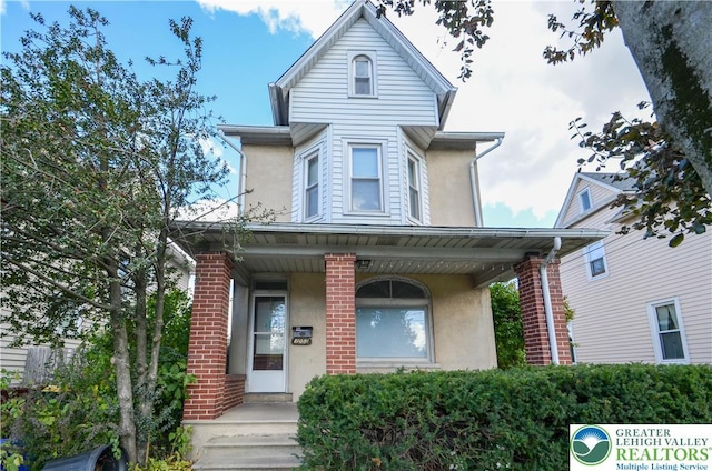 1053 3rd St, Whitehall Twp, PA 18052 - victorian home with stucco siding and covered porch