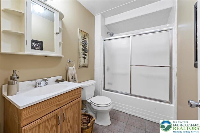215 N Laurel Ln, West Whiteland Township, PA 19341 - bathroom with toilet, vanity, tile patterned floors, and enclosed tub / shower combo