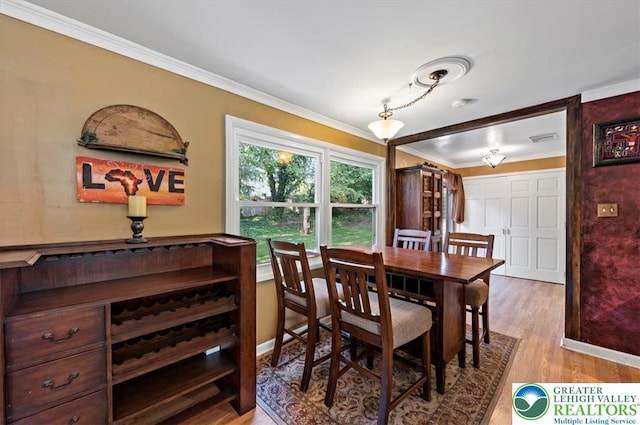 215 N Laurel Ln, West Whiteland Township, PA 19341 - dining room featuring crown molding, wood finished floors, and baseboards