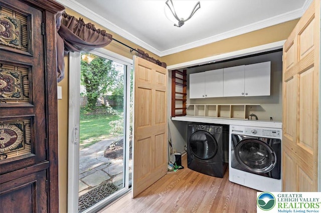 215 N Laurel Ln, West Whiteland Township, PA 19341 - washroom with washer and clothes dryer, cabinet space, light wood finished floors, and crown molding