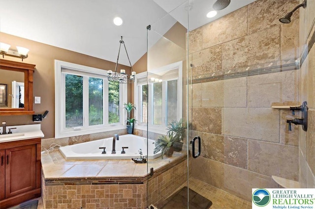 215 N Laurel Ln, West Whiteland Township, PA 19341 - bathroom with vanity, a shower stall, a garden tub, vaulted ceiling, and a chandelier