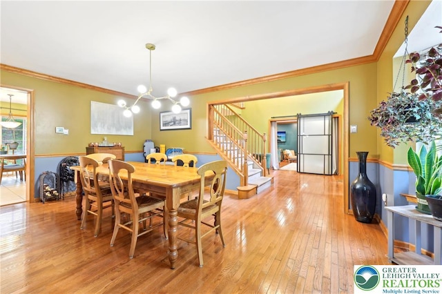 136 Outlook Ct, Middle Smithfield Twp, PA 18302 - dining area featuring ornamental molding, a chandelier, stairway, and light wood-style flooring