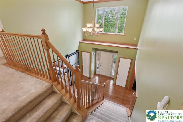 136 Outlook Ct, Middle Smithfield Twp, PA 18302 - entrance foyer with a chandelier, wood finished floors, and stairway