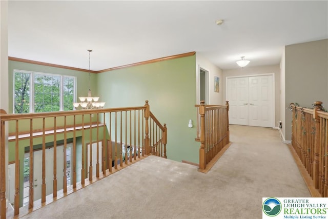 136 Outlook Ct, Middle Smithfield Twp, PA 18302 - hall featuring a chandelier, an upstairs landing, carpet, and baseboards