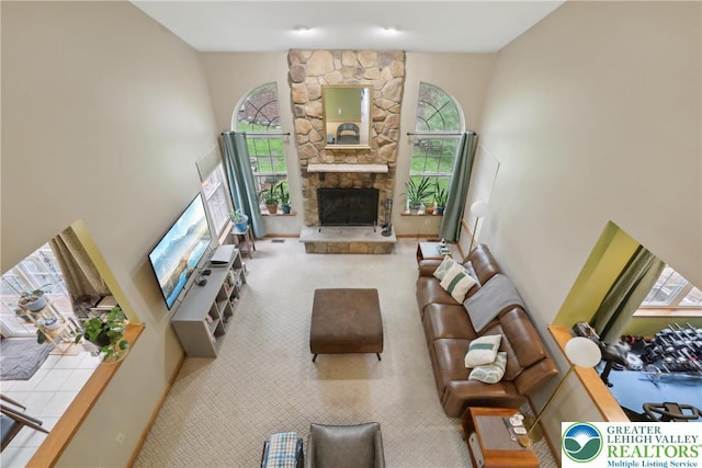 136 Outlook Ct, Middle Smithfield Twp, PA 18302 - living room with plenty of natural light, carpet, a fireplace, and a high ceiling