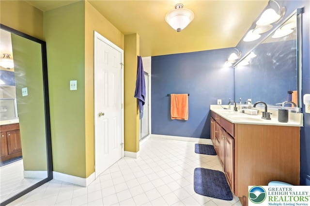 136 Outlook Ct, Middle Smithfield Twp, PA 18302 - full bathroom with double vanity, tile patterned flooring, an enclosed shower, and baseboards