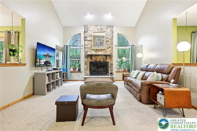 136 Outlook Ct, Middle Smithfield Twp, PA 18302 - living area with vaulted ceiling, baseboards, carpet floors, and a fireplace