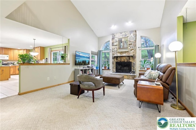 136 Outlook Ct, Middle Smithfield Twp, PA 18302 - living room featuring high vaulted ceiling, light colored carpet, baseboards, a stone fireplace, and recessed lighting