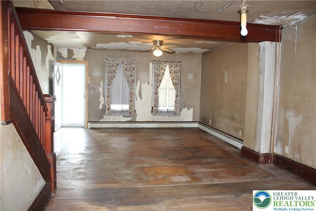 466 Franklin Ave, Palmerton Borough, PA 18071 - unfurnished room with wood-type flooring, stairway, a ceiling fan, beam ceiling, and a baseboard radiator