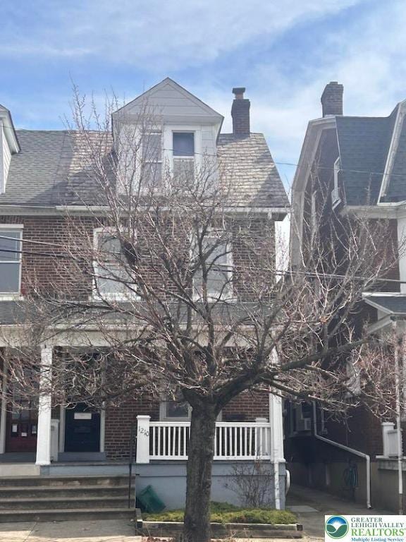 1210 Linden, Bethlehem City, PA 18018 - view of front of home featuring a chimney, a porch, and brick siding