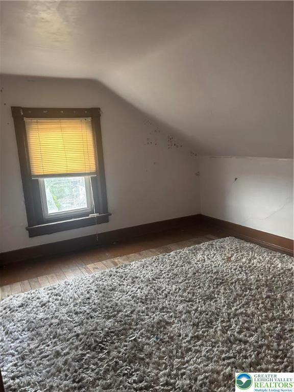 1210 Linden, Bethlehem City, PA 18018 - bonus room with vaulted ceiling, wood-type flooring, and baseboards