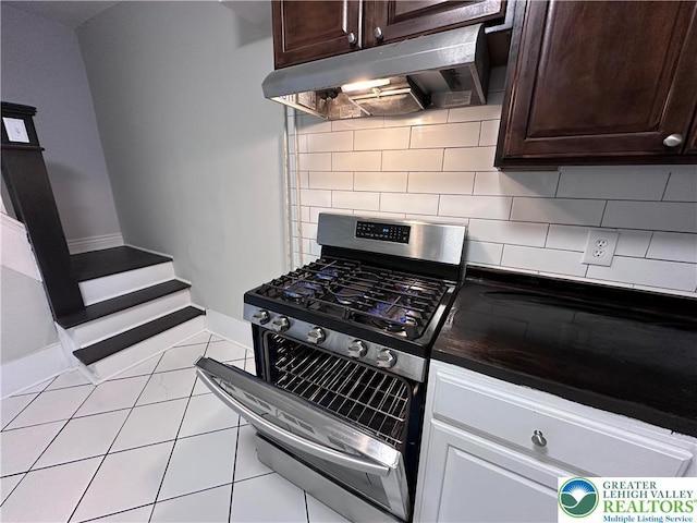 432 Schaffers Ct, Easton, PA 18042 - kitchen with under cabinet range hood, gas range, dark brown cabinets, and tasteful backsplash