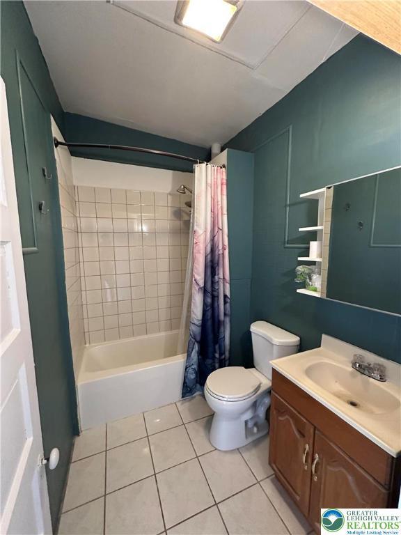 432 Schaffers Ct, Easton, PA 18042 - bathroom with tile patterned floors, vanity, toilet, and shower / bath combination with curtain