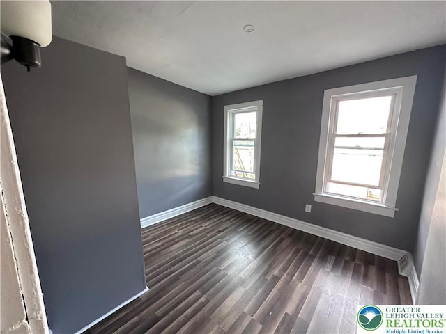 432 Schaffers Ct, Easton, PA 18042 - unfurnished room featuring healthy amount of natural light, baseboards, and dark wood-style flooring