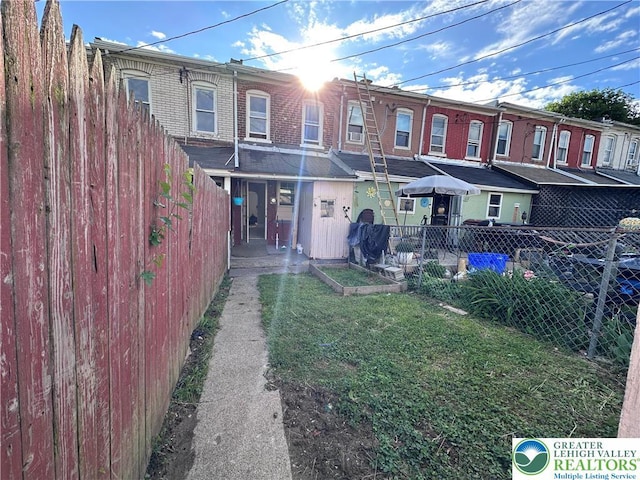 432 Schaffers Ct, Easton, PA 18042 - back of property with a vegetable garden and brick siding