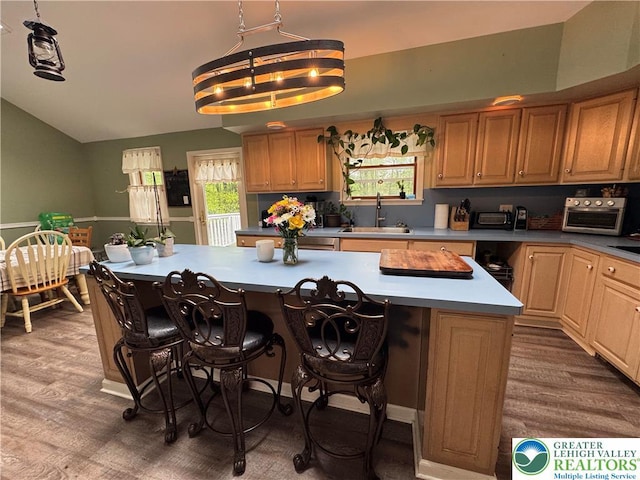 462 Plane St, Weatherly Boro, PA 18255 - kitchen with a sink, wood finished floors, a center island, a kitchen breakfast bar, and lofted ceiling