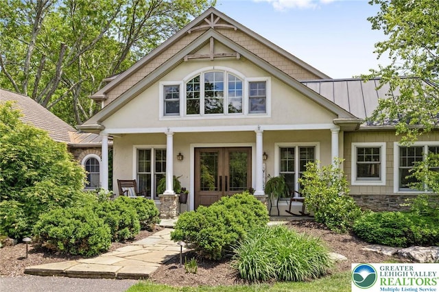 2965 Adams Way, Springfield Twp, PA 18077 - view of front of property with covered porch, a standing seam roof, metal roof, and stucco siding
