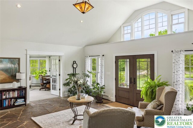 2965 Adams Way, Springfield Twp, PA 18077 - entrance foyer with french doors, healthy amount of natural light, stone tile flooring, and high vaulted ceiling